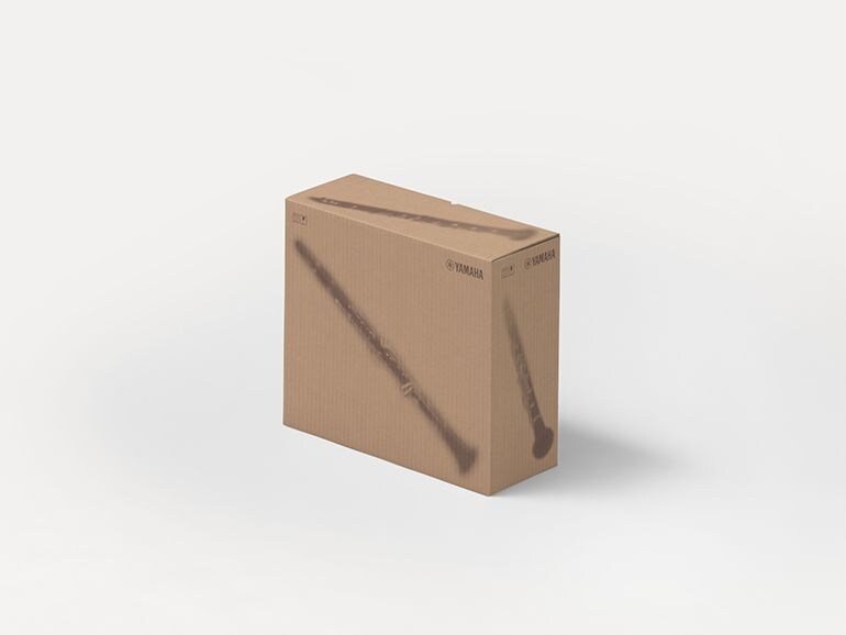 Yamaha cardboard shipping boxes with printed silhouettes of musical instruments.