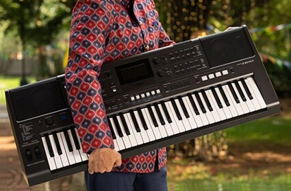 Person with Yamaha PSR-I610 keyboard