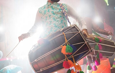 A man playing the Dhol